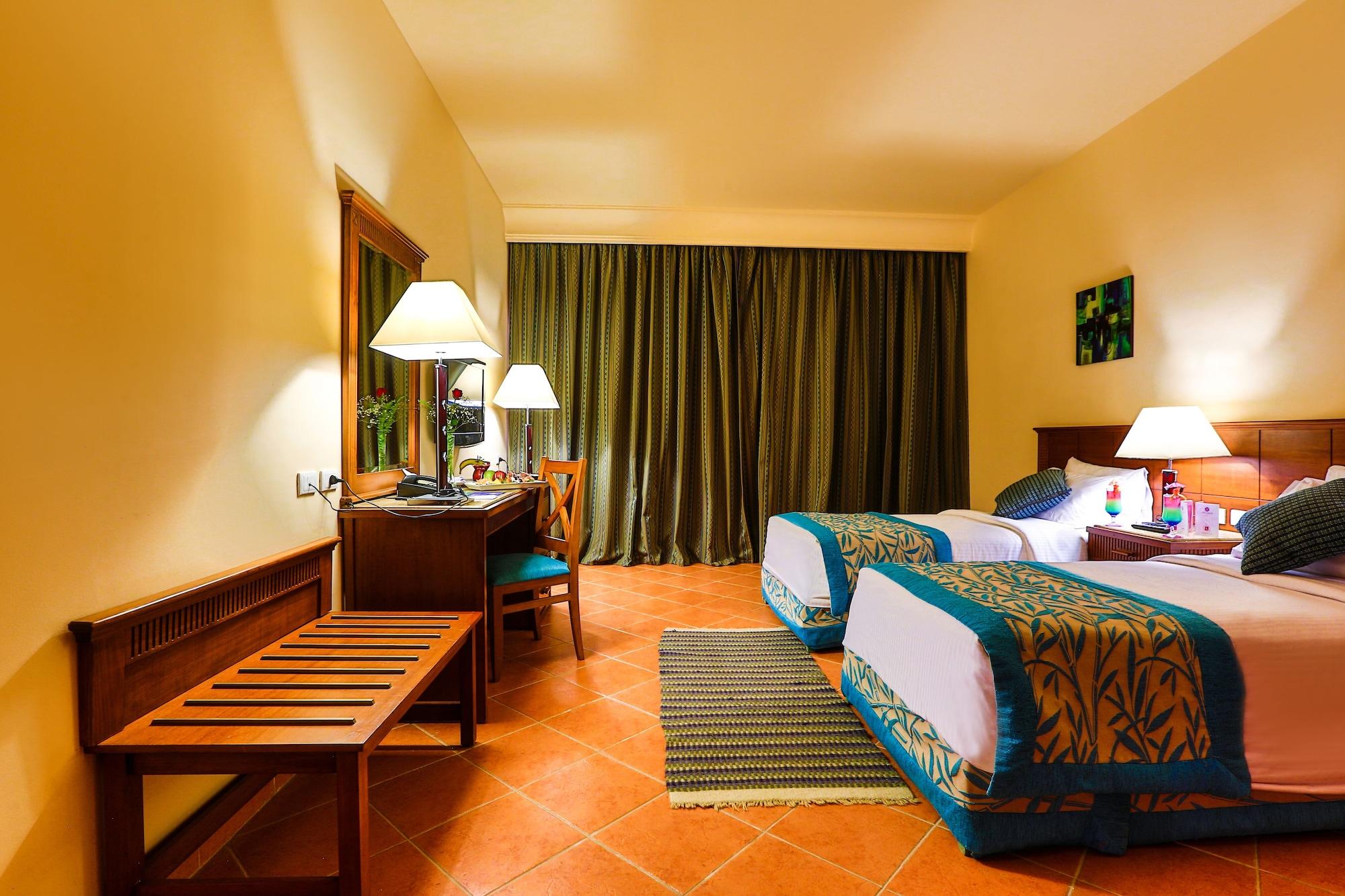 Charmillion Club Aquapark Hotel ชาร์มเอลชีค ภายนอก รูปภาพ A room at the hotel